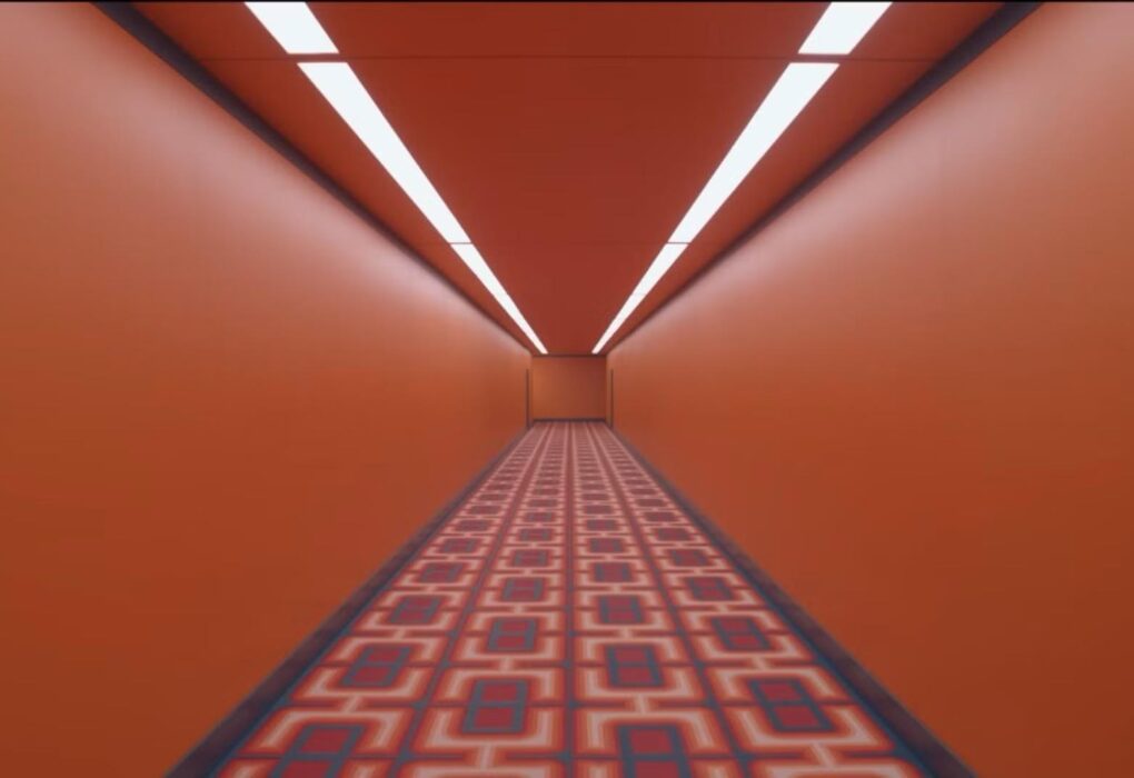 orange hallway with patterned carpet from The Substance