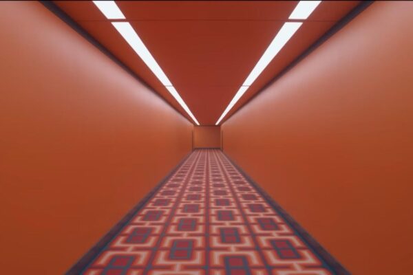 orange hallway with patterned carpet from The Substance